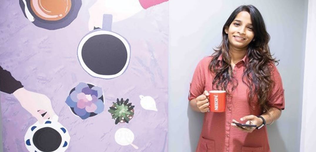 woman holding cup of coffee
