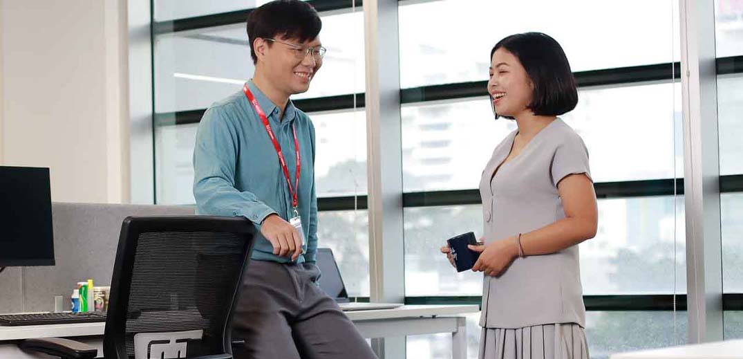 man and woman in office
