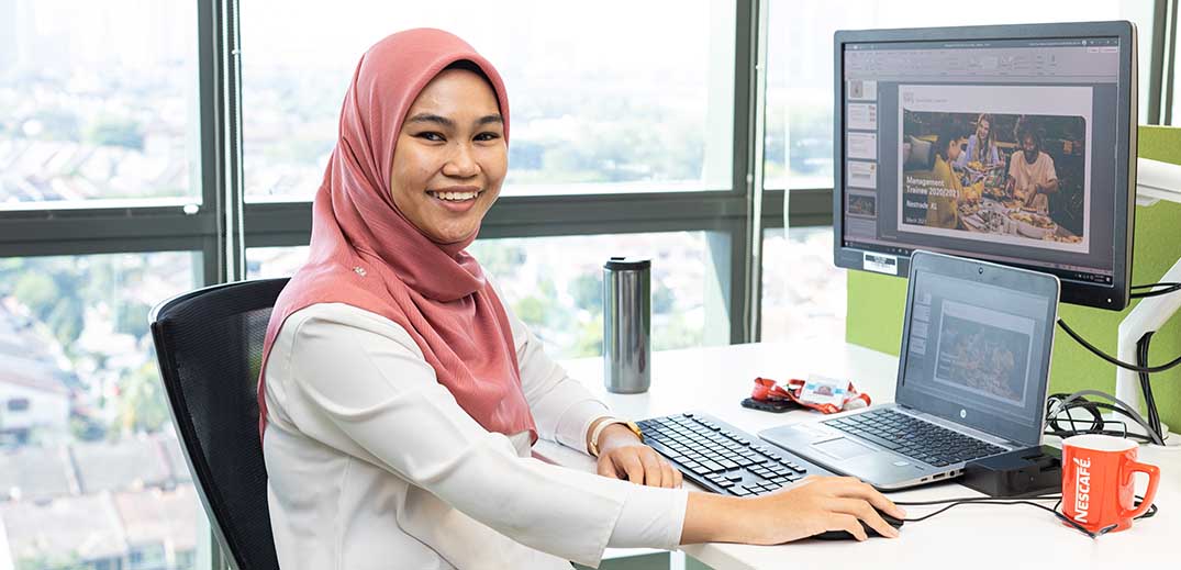 woman in office by computer