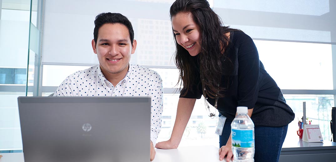 man and woman in office